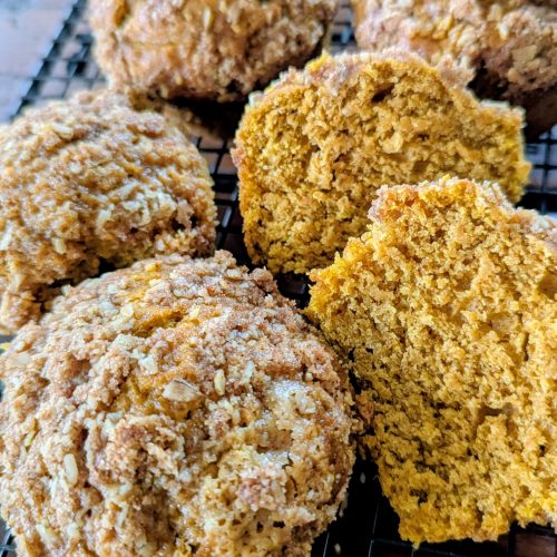 Sourdough pumpkin muffins on a wire rack