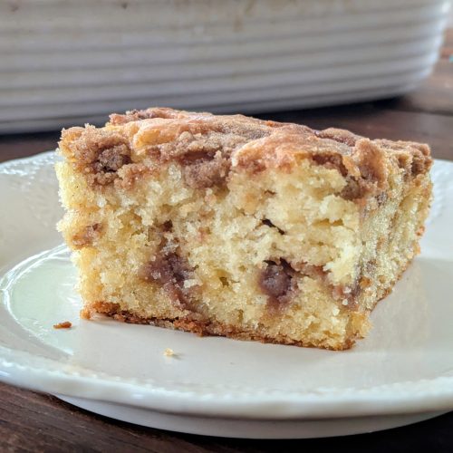 Slice of sourdough discard coffee cake with cinnamon filling